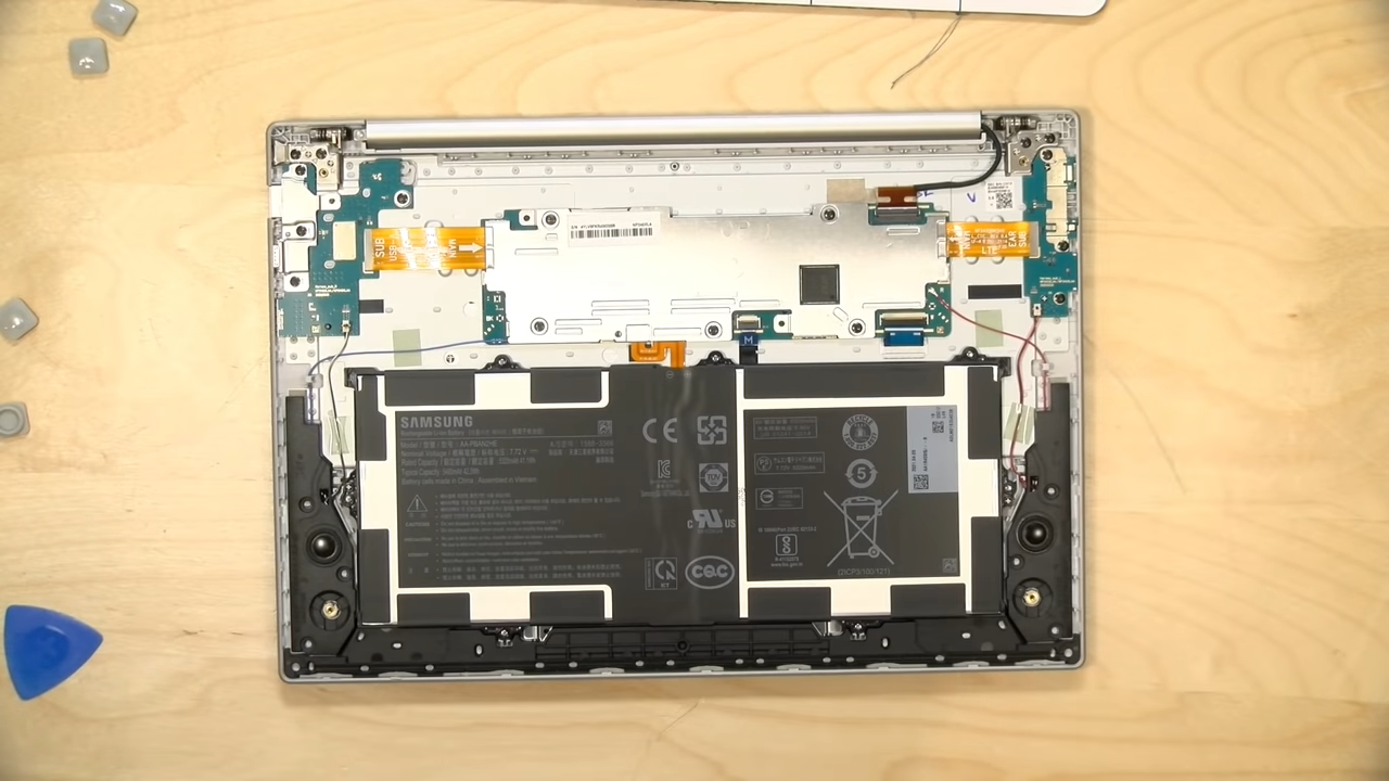 YouTube screenshot: A laptop with its bottom cover removed, showing the internals.