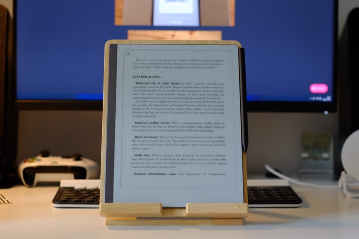 Picture on reMarkable 2 showing a book on the screen, on a bamboo tablet stand.